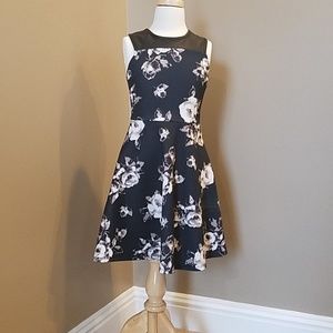 Girls black floral dress with faux leather.